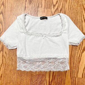 white lace cropped top with a bow